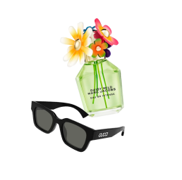 Black Gucci sunglasses  next to a Marc Jabobs' Daisy Wild perfume green bottle with decorative flowers on the lid.