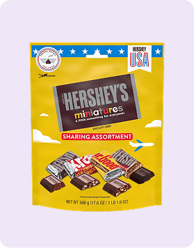 A bag of Hershey's miniatures assortment set against white background.